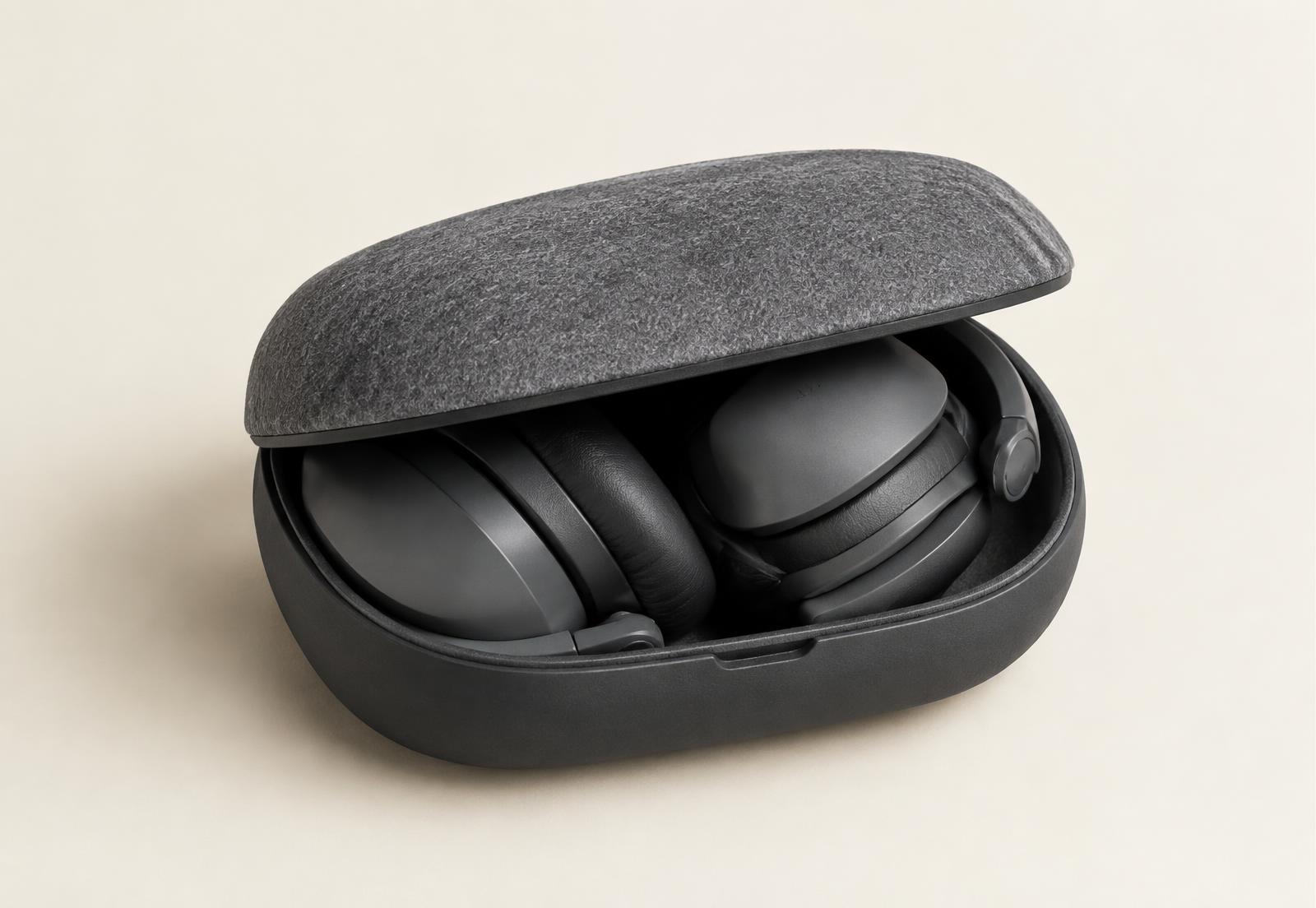 Felt-lined charging case holding folded headphones
